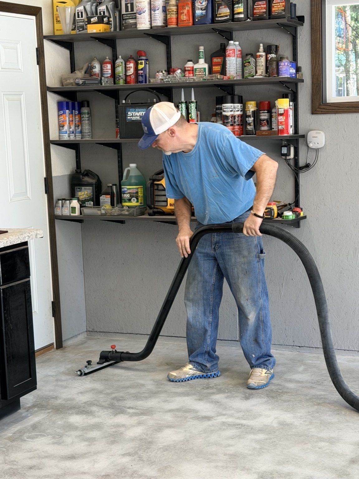 Cleaning the surface on this garage floor project